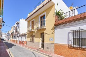 a row of buildings on a street at Naranja apartment in Nerja