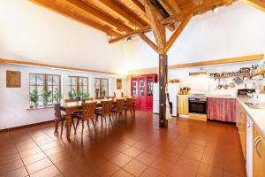 a kitchen and dining room with a table and chairs at Ole Schün Dannau in Oldenburg in Holstein