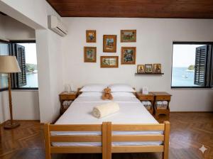 a bedroom with a bed with a teddy bear on it at Мечта in Kruče