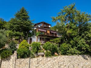 a house on top of a stone wall at Мечта in Kruče