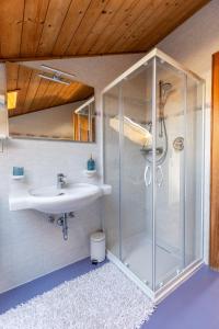 a bathroom with a shower and a sink at Haus Simon in Nova Levante +15 photos