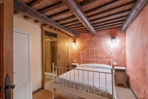 a bedroom with a metal bed in a room at Casa Subiraneta in Puigreig +25 photos