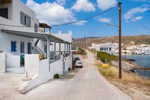 a street in a village with white buildings at Gorgona 1 in Loutra
