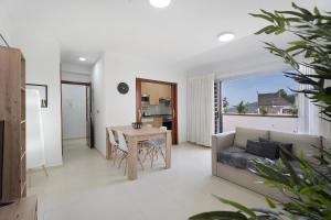 a living room with a couch and a table at Apartamento Opuntia in La Orotava