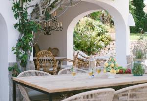 a table with wine glasses on a patio at Villa Torre in Jávea