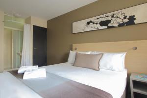 Postel nebo postele na pokoji v ubytování ibis Budget - Melbourne CBD