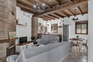 a living room with a couch and a table at Casas al Alba in Zahora