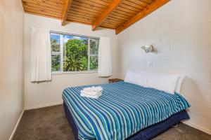 Postel nebo postele na pokoji v ubytování Aloha Seaview Resort Motel + 37 fotografií