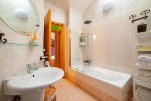 a bathroom with a sink and a tub and a toilet at Il Dolce Risveglio in Fossacesia +33 photos