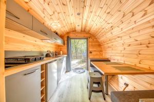 a kitchen with wooden walls and a wooden ceiling at Otonneauxstress - Vigneron in Saint-Vivien-de-Médoc +17 photos