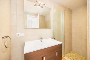 a bathroom with a sink and a shower at Ca Na Bel in Cala Ratjada +22 photos