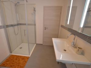 a bathroom with a shower and a sink at Ferienwohnungen Ambiente-Schmidt in Olsberg +31 photos