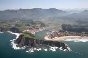an aerial view of a island in the ocean at 'Socaire' Ribadesella in Ribadesella