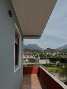 a balcony with a view of a city at 3 Roots Villa in Krujë +8 photos