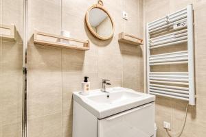 a bathroom with a sink and a mirror at Gite Barrail du Moulin in Bégadan +18 photos