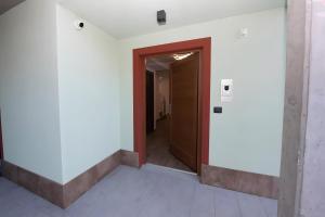a hallway with a door in a building at Appartamenti Suly 4 - Cir0085 in Saint Vincent