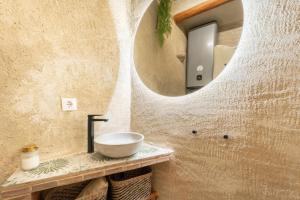 a bathroom with a sink and a mirror at El Kubo in Olba +26 photos