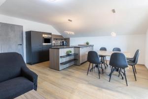 a kitchen and dining room with a table and chairs at Zeichner in Geisingen