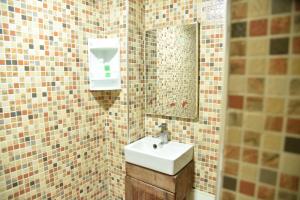 a bathroom with a sink and a mirror at Auberge Resto Agnaoue in Marrakesh +72 photos