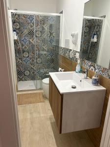 a bathroom with a sink and a toilet and a shower at B&B Le Eolie in Milazzo +27 photos
