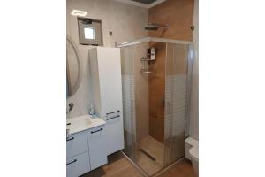 a bathroom with a shower and a sink at Apartment Vergina in Áyioi Dhéka +20 photos