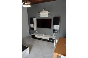 a living room with a flat screen tv on a wall at Apartment Vergina in Áyioi Dhéka