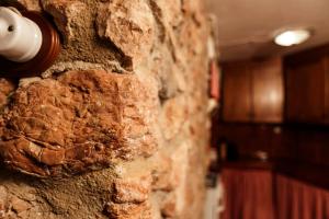 a brick wall with a light switch on it at Cal Marti in Farena