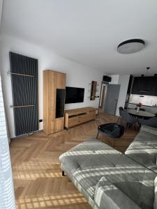 a living room with a couch and a table at Sofia Tech Park Apartments - Premium in Sofia