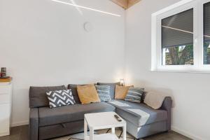a living room with a couch and a window at Ferienwohnung Seeglück in Moos