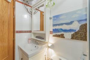 a bathroom with a sink and a mirror at Casa Rosi Cave House in Artenara +15 photos