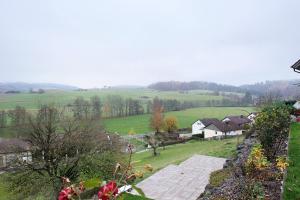 a view of a field with houses and trees at Ferienwohnung Talblick in Stockach