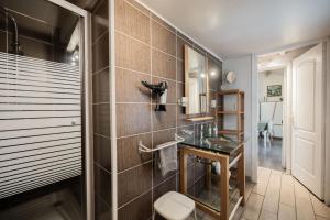 a bathroom with a sink and a toilet at Gîtes le Clos des Pradals in Tarascon-sur-Ariège +43 photos