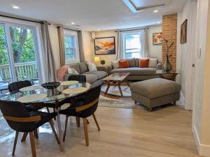 a living room with a table and a couch at Modern Comfort in Marlborough