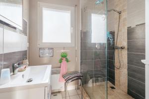a bathroom with a sink and a shower at Les chambres de Florence in Saint-Jouan-de-lʼIsle +30 photos