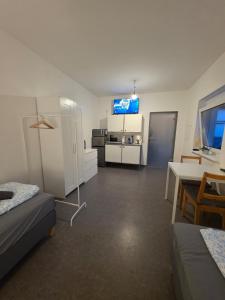 a room with a room with a kitchen and a living room at Relax after work in Ochsenhausen