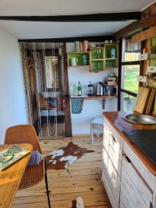 a kitchen with a table and a counter top at Pepper Huis in Lemgo +11 photos