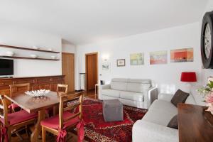 a living room with a couch and a table at Apartment Bossi View in Chiavenna