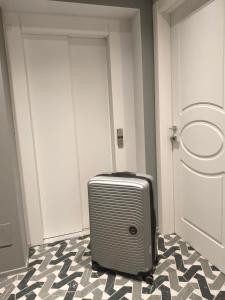 a suitcase sitting in a room next to a door at Strettorooms in Villa San Giovanni +35 photos