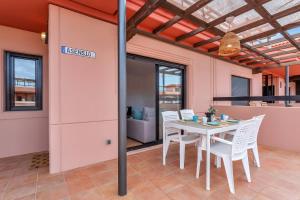 a dining room with a table and chairs at Villa Asensio in Lajares