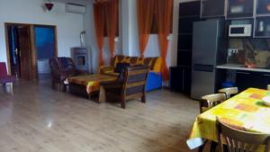 a living room with a couch and a table at Cortijo la Era in Castril
