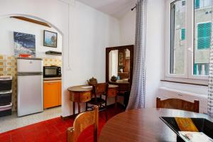 a kitchen with a table and a dining room at Lisettarooms in Vernazza