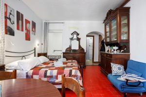 a bedroom with a bed and a table and a chair at Lisettarooms in Vernazza +62 photos