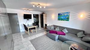 a living room with a couch and a table at Ferienpark Oberallgäu Haus 1 in Missen-Wilhams
