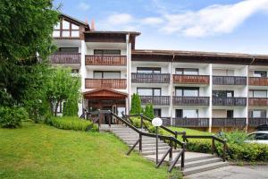 an apartment building with stairs in front of it at Ferienpark Oberallgäu Haus 1 in Missen-Wilhams