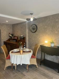a dining room with a table and a piano at La Cure Vosgienne in Champdray +36 photos
