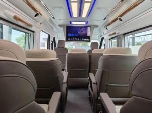 an empty train car with a tv on the ceiling at Ultra Premium Camper Van in New Delhi