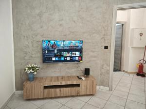 a living room with a flat screen tv on a wall at DeMarchi in Biella
