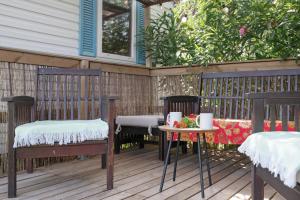 a patio with two chairs and a table with at Calma in Barbate +15 photos