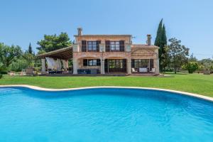 a large swimming pool in front of a house at Son San Marti Gran in Can Picafort