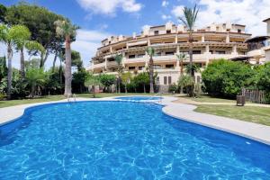a swimming pool in front of a building at Villa Gadea 4-2 in Altea